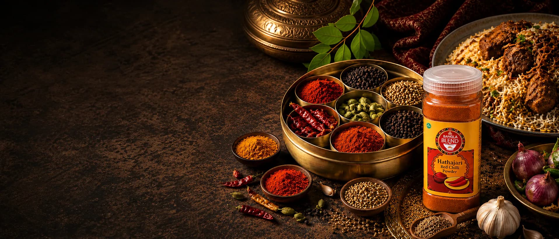Bangla Blend Hathajari red chilli powder with a brass spice box and a regional rice dish